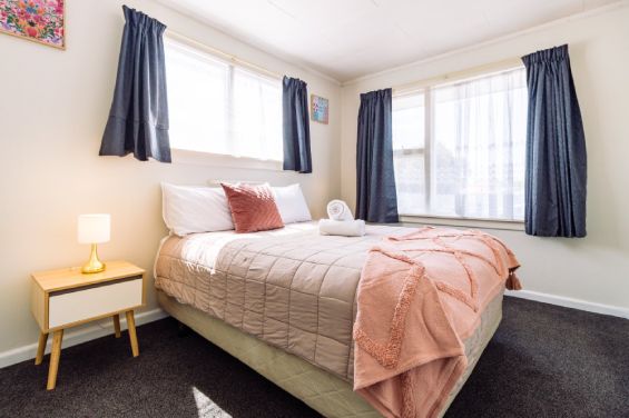 Comfortable master bedroom with premium linens in the One-Bedroom Standard unit at Belle Bonne Motel Christchurch