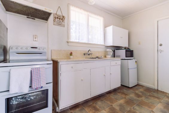 Full kitchen in the One-Bedroom Superior unit at Belle Bonne Motel Christchurch