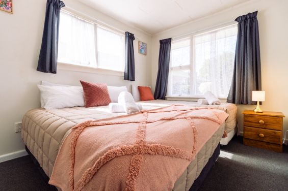 Welcoming bedroom area in the One-Bedroom Large Suite at Belle Bonne Motel Christchurch