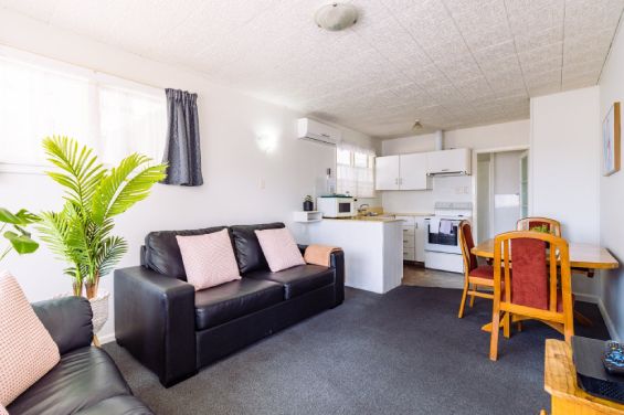 Family-sized lounge and living area at the Two-Bedroom Standard unit at Belle Bonne Motel Christchurch