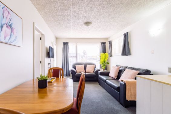 Family-sized lounge and living area at the Two-Bedroom Standard unit at Belle Bonne Motel Christchurch