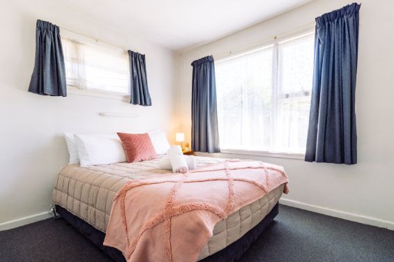 Comfortable master bedroom with premium linens in the Two-Bedroom Standard unit at Belle Bonne Motel Christchurch