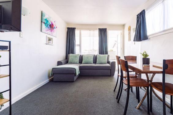 Sofa folds out into a bed in the Large Apartment at Belle Bonne Motel Christchurch