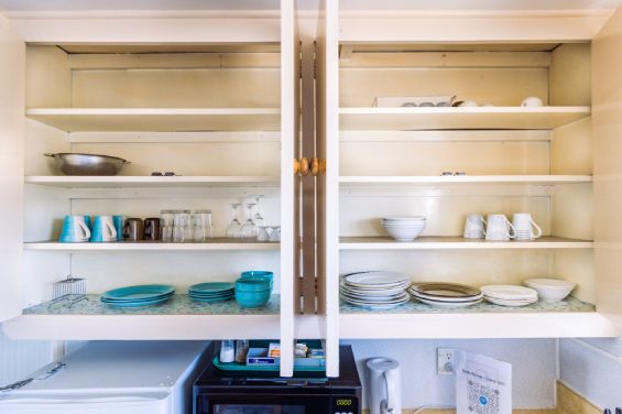 Crockery and all facilities in the full-sized kitchen in the Large Two-Bedroom Apartment at Belle Bonne Motel Christchurch