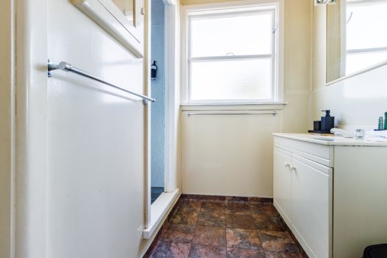 The bathroom has a shower and free toiletries in the Large Two-Bedroom Apartment at Belle Bonne Motel Christchurch