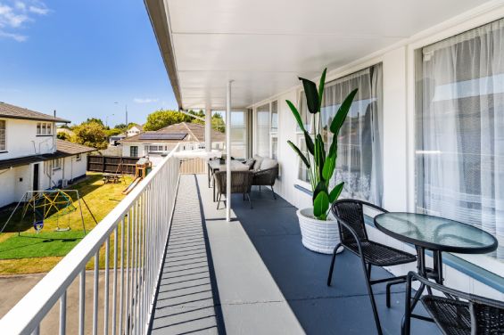 Private balcony with outdoor seating at the Large Two-Bedroom Apartment at Belle Bonne Motel Christchurch