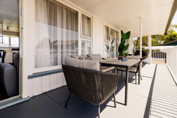 Comfortable seating on the private balcony at the Large Two-Bedroom Apartment at Belle Bonne Motel Christchurch